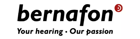 Schriftzug 'bernafon' in schwarzer Schrift, rechts oben roter Kreis mit weißem stilisiertem Hörgerät, darunter Slogan 'Your hearing  Our passion' in kursiver schwarzer Schrift.